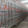 A base roll cage. 4 sided with base and mid shelves. Split doors